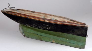 An early 20th century scratch built pond yacht hull - black and green below the waterline, with a