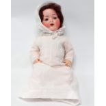 An early 20th century Armand Marseille bisque head doll - with blue articulated eyes, open mouth
