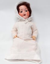 An early 20th century Armand Marseille bisque head doll - with blue articulated eyes, open mouth