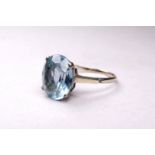 A 9ct white gold aquamarine ring - the oval cut stone with a claw setting, ring size T, weight 4.