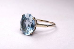 A 9ct white gold aquamarine ring - the oval cut stone with a claw setting, ring size T, weight 4.