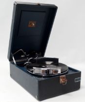 A portable gramophone, HMV Model 102, in blue case, circa 1935, with an unusual chrome record