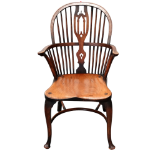 A late 19th/early 20th century ash and elm Windsor chair - the arched top rail and spindle back with