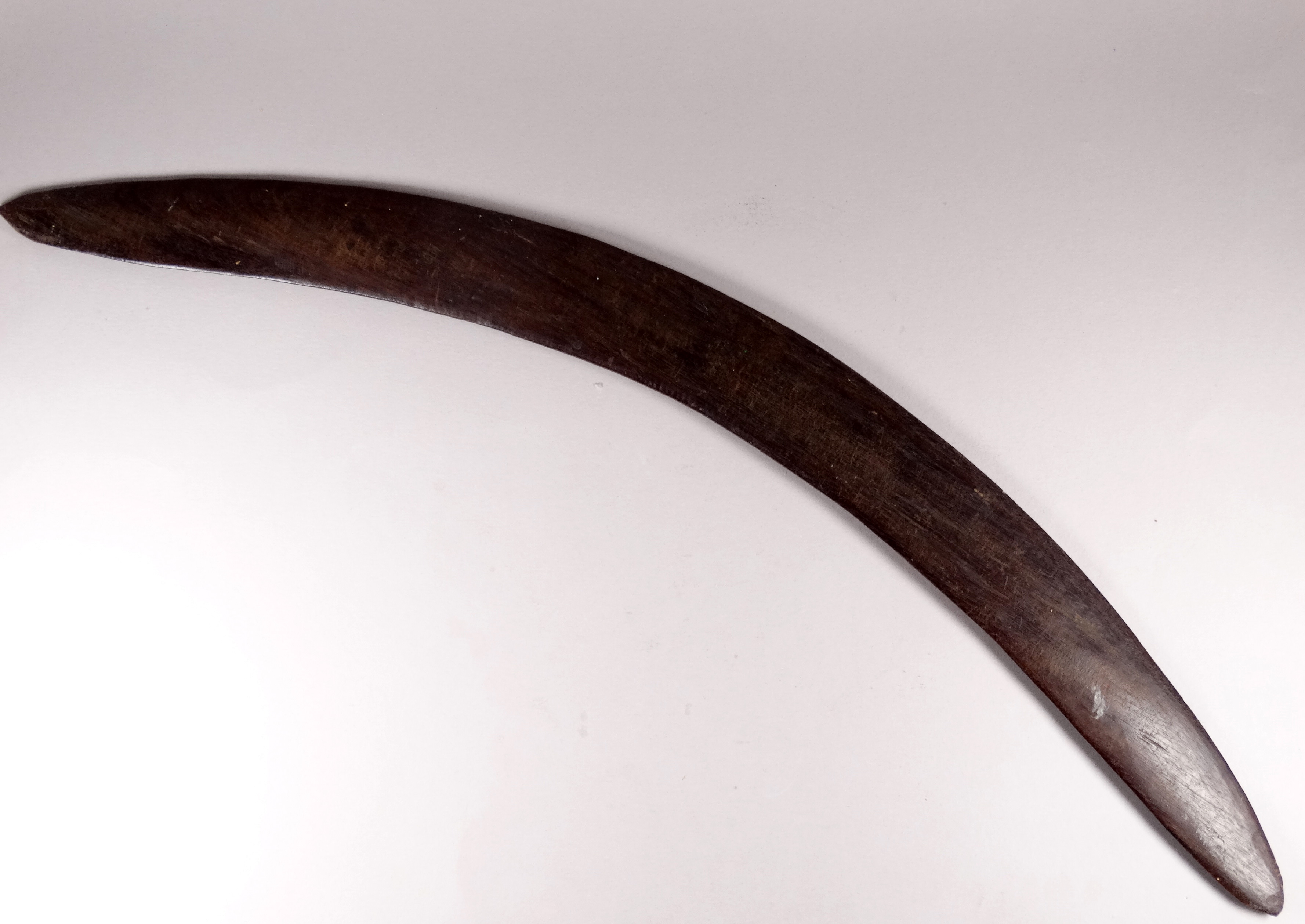 An early 20th century Australian hardwood boomerang - with linear incised panel decoration, length - Image 5 of 5
