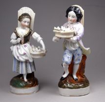 A pair of 19th century German figures - male and female flower sellers, carrying baskets and hods,