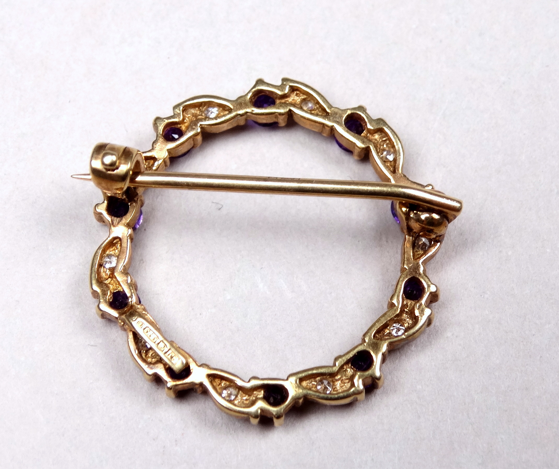 A 9ct yellow gold amethyst and diamond annular brooch - with a leaf setting, weight 2.8g. - Image 3 of 4