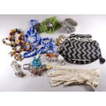 A small quantity of costume jewellery - including a bead purse bag, a rhinestone set bangle and