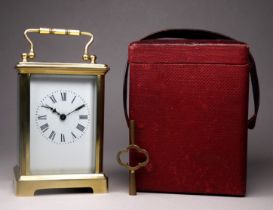 A 20th century carriage timepiece - with a corniche case and white enamel dial set out in Roman