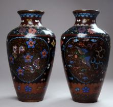 A pair of late 19th century Japanese cloisonne vases - of baluster form and decorated with birds and