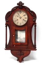 An early 20th century walnut cased American wall clock - the leaf carved case with glazed panel door