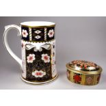 A Royal Crown Derby Millennium mug - of Imari pattern, height 14cm, together with an oval lidded box