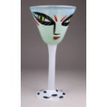 Ulrika Hydman VALLIEN (Swedish, 1938-2018) for Kosta Boda - a wine glass decorated with a face,