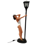 A 20th century cast resin table lamp - modelled as an exotic lady in white swimsuit below a street