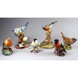 A Royal Worcester bird group - chaffinches on a branch, height 14cm, together with five further