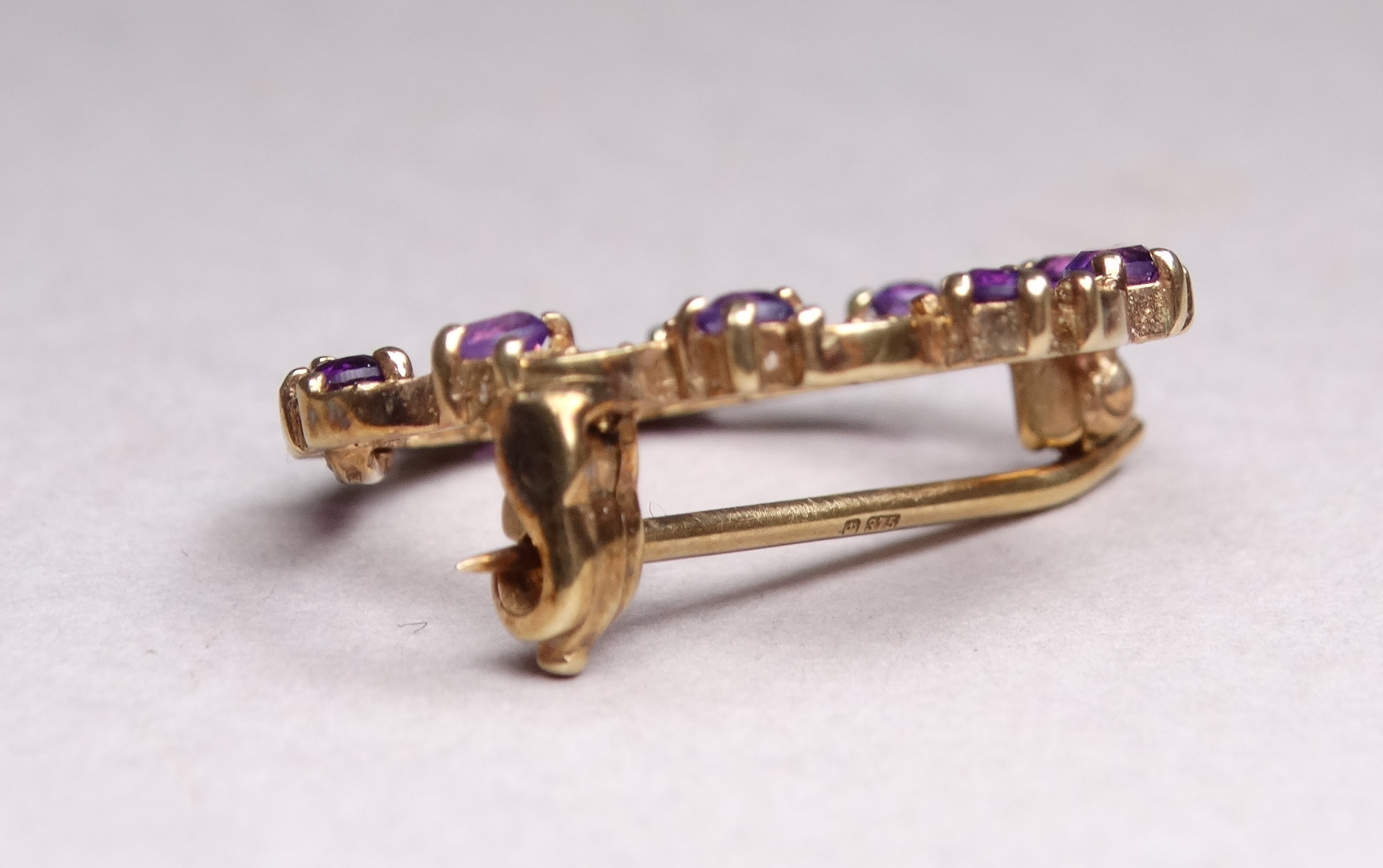 A 9ct yellow gold amethyst and diamond annular brooch - with a leaf setting, weight 2.8g. - Image 4 of 4
