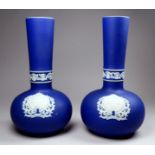 A pair of Adams Jasperware vases - bulbous with a narrow neck and decorated with the Penzance