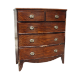 A Victorian mahogany bowfront chest of drawers - with an arrangement of two short and three long