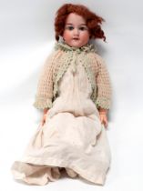 An Armand Marseille bisque head doll - impressed 'Armand Marseille DRGM 246/1. 390. A2M', with