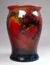 A William Moorcroft vase - flambe leaf and berries pattern, impressed marks and signature to base,