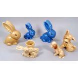 A Sylvac bunny - brown glazed, height 12cm, together with two further graduated blue glazed bunnies,