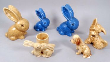 A Sylvac bunny - brown glazed, height 12cm, together with two further graduated blue glazed bunnies,