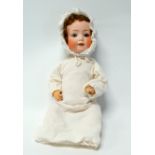 An early 20th century Heubach & Koppelsdorf bisque head doll - stamped and numbered 320.3,