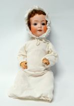 An early 20th century Heubach & Koppelsdorf bisque head doll - stamped and numbered 320.3,