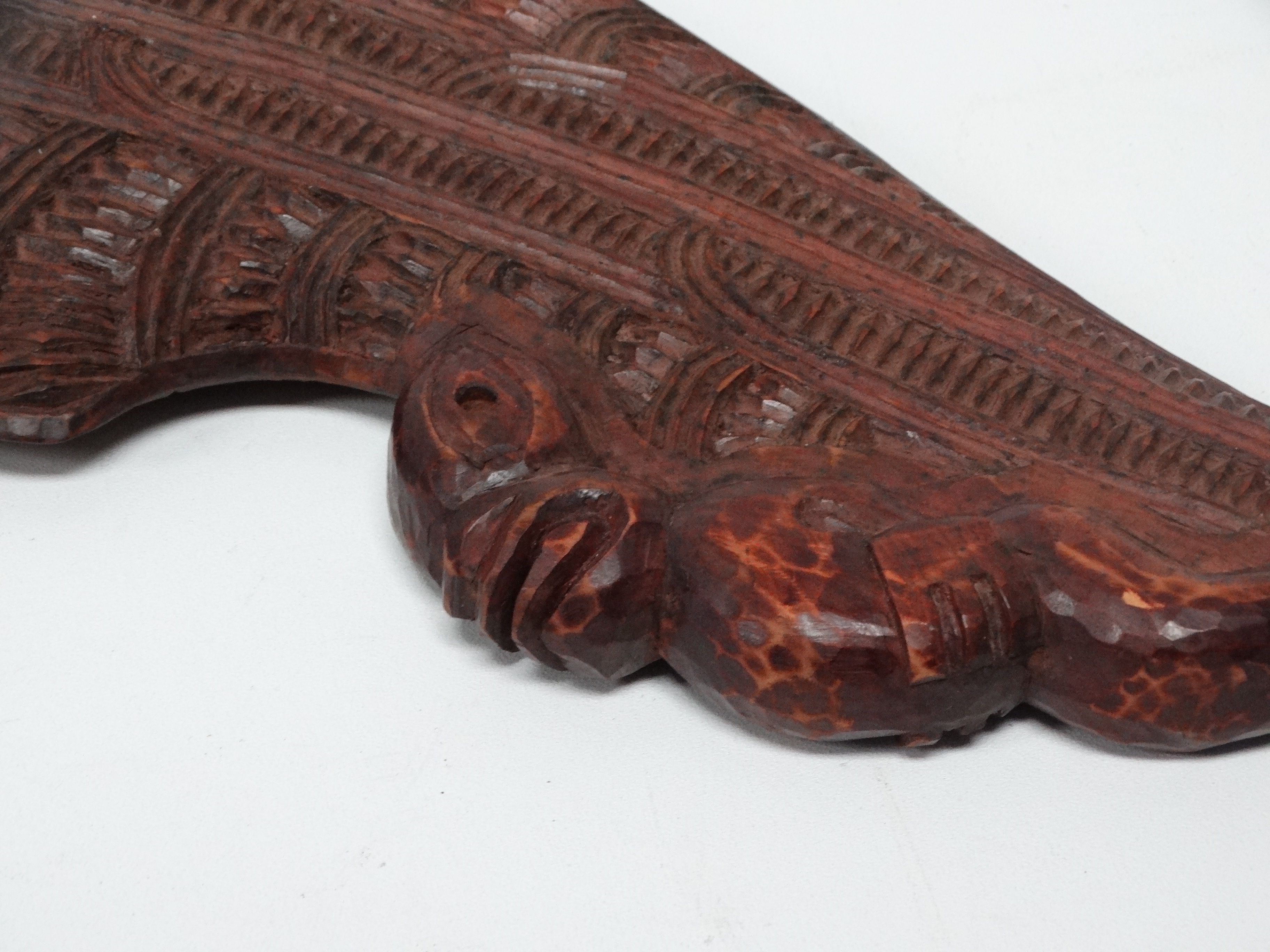 A Maori hand club wahaika - with linear and notched carving to the blade and with a tiki figure to - Image 2 of 4