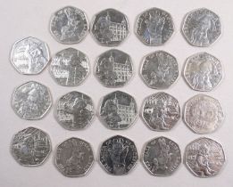 Twenty collectable 50 pence coins - to include Paddington Bear and Peter Rabbit.