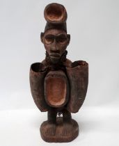 A Tribal Art West African Bakongo 'Cult' standing wooden fetish of male figure form - hung around