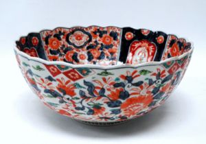 A late 19th century Imari bowl - with a scalloped rim and of typical palette, decorated with