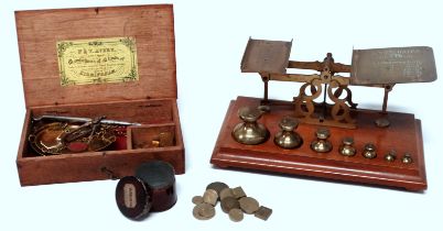 A set of late 19th century brass postal scales - with seven original graduated bell weights, width