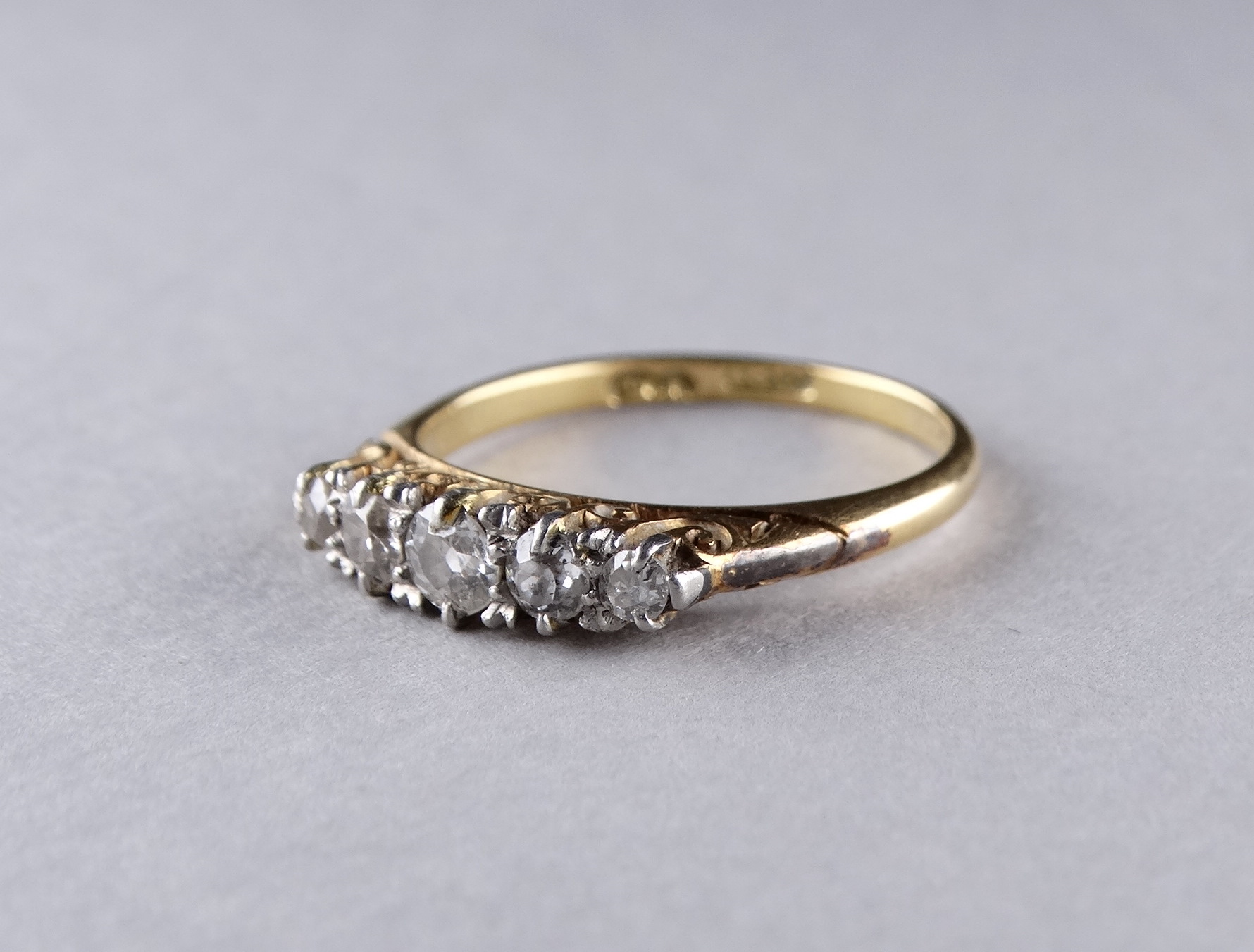 A five stone diamond ring - with a foliate scroll setting on an 18ct yellow gold band, ring size - Image 3 of 3