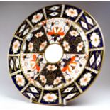 A Royal Crown Derby dish - decorated in the typical Imari pattern, diameter 26cm.