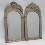 A pair of Venetian style etched glass wall mirrors - the arched plate with foliate margin plates,