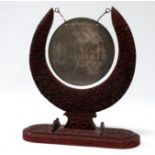 A 20th century Indian gong - engraved with an image of the Taj Mahal and suspended from foliate