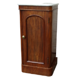 A late 19th century mahogany pot cupboard - with white marble top and arched panel door enclosing