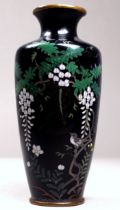 An early 20th century cloisonne vase - decorated with a bird amongst wisteria flowers, height 11.