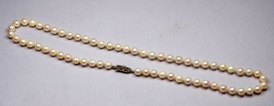 A string of uniform pearls - with 9ct yellow gold filigree clasp, length 48cm.