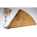 A late 19th century Japanese carved sandalwood fan - the sticks with similar painted decoration