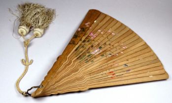 A late 19th century Japanese carved sandalwood fan - the sticks with similar painted decoration