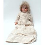 An Armand Marseille bisque shoulder head doll - with brown glass sleeping eyes, open mouth, teeth,