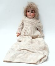 An Armand Marseille bisque shoulder head doll - with brown glass sleeping eyes, open mouth, teeth,