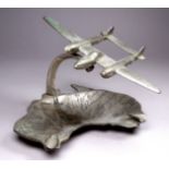 Of aviation interest - a chrome plated ashtray in the form of a twin engine aircraft above a dish