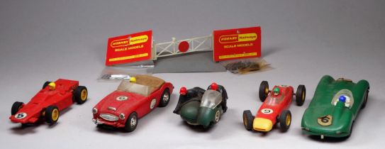 A Scalextric B2 Hurricane motorcycle combination - green with riders in black with red helmets,