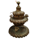 A large brass Ottoman incense burner - of gadrooned squat baluster form and raised on three