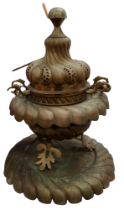 A large brass Ottoman incense burner - of gadrooned squat baluster form and raised on three