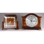 An Art Deco style walnut mantle timepiece by Elliott - with a square silvered dial set out in