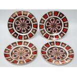 Four Royal Crown Derby Imari plates - pattern 1128, each diameter 22cm.