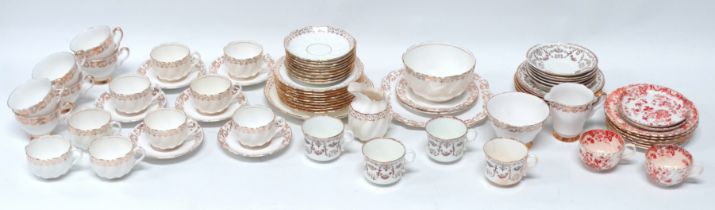 A Victorian Staffordshire part tea service - decorated with gilt foliate bands on spiral fluted